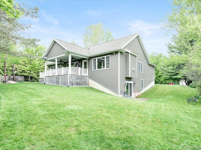 5076 Birch Ave, Lexington, MI 48450 - rear view of house featuring a ceiling fan and a yard