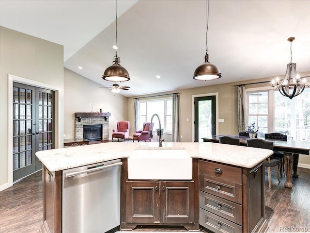5076 Birch Ave, Lexington, MI 48450 - kitchen featuring dishwasher, a sink, dark wood-style flooring, dark brown cabinets, and open floor plan