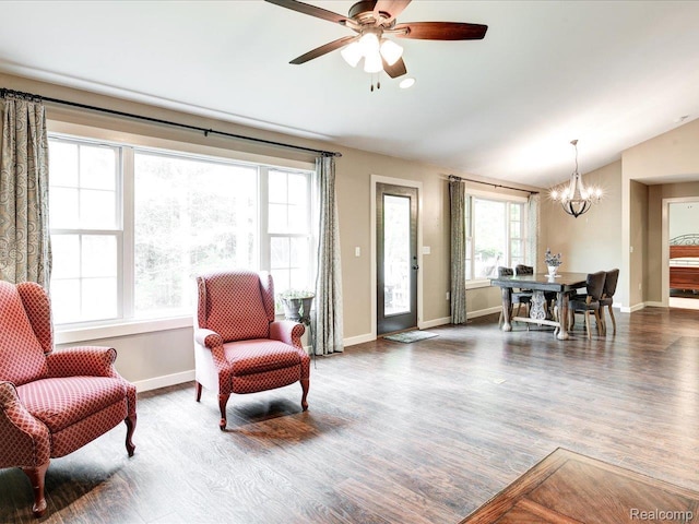5076 Birch Ave, Lexington, MI 48450 - living area with a chandelier, lofted ceiling, wood finished floors, baseboards, and ceiling fan