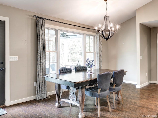 5076 Birch Ave, Lexington, MI 48450 - dining area with a chandelier, dark wood-style floors, and baseboards