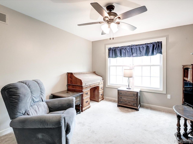 5076 Birch Ave, Lexington, MI 48450 - living area featuring carpet, baseboards, and a ceiling fan