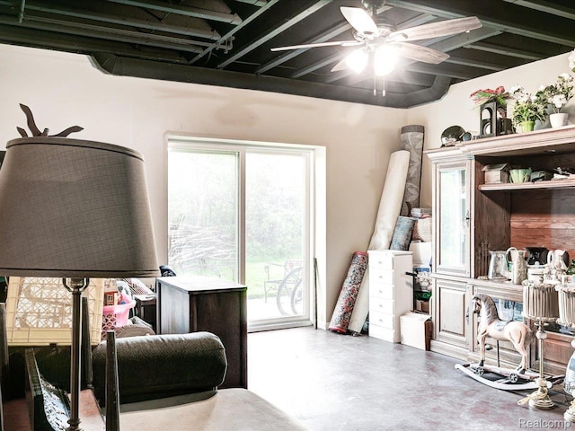 5076 Birch Ave, Lexington, MI 48450 - living area featuring finished concrete floors and a ceiling fan