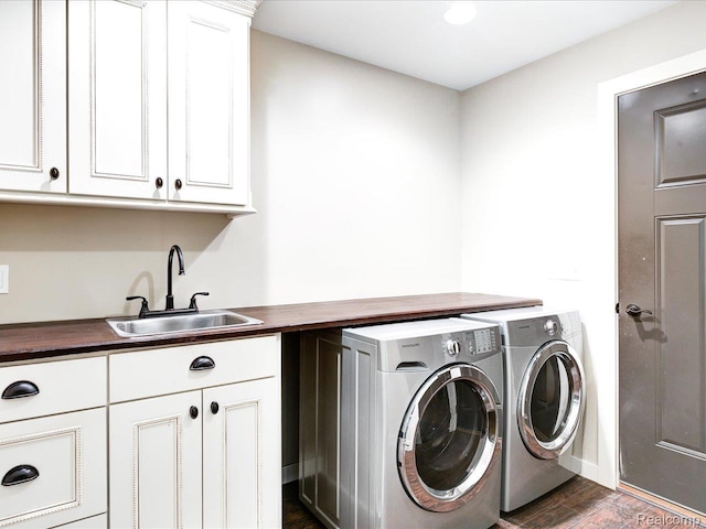 5076 Birch Ave, Lexington, MI 48450 - laundry room featuring cabinet space, washing machine and dryer, dark wood finished floors, and baseboards