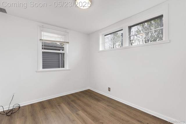 464 W Jarvis Ave, Hazel Park, MI 48030 - spare room featuring baseboards and dark wood-type flooring