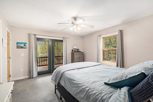 5301 Durga Rd, Williamsburg, MI 49690 - carpeted bedroom with access to outside, baseboards, and a ceiling fan