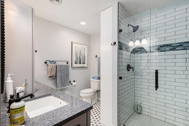 5301 Durga Rd, Williamsburg, MI 49690 - bathroom featuring a shower stall, vanity, toilet, and recessed lighting