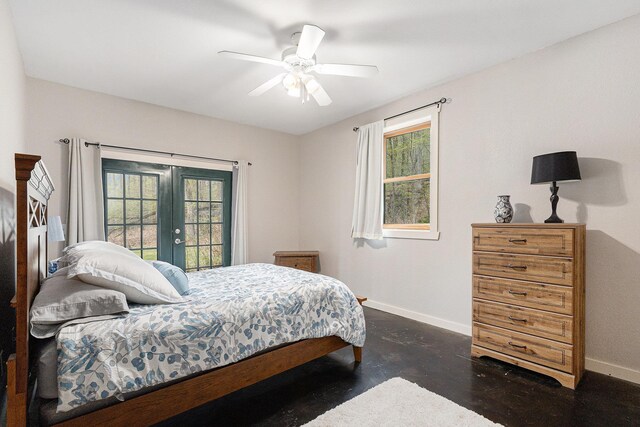 5301 Durga Rd, Williamsburg, MI 49690 - bedroom featuring baseboards, multiple windows, and french doors