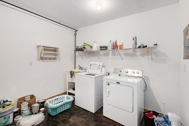 5301 Durga Rd, Williamsburg, MI 49690 - laundry area with washing machine and clothes dryer and an AC wall unit