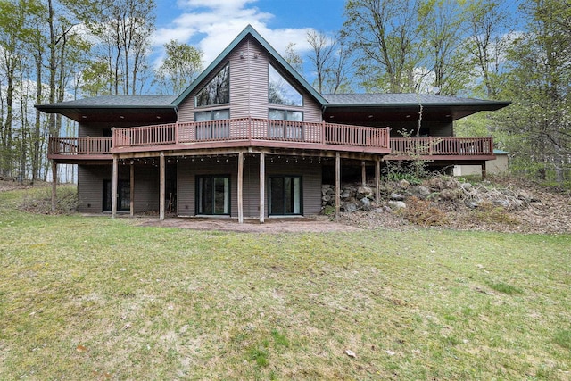5301 Durga Rd, Williamsburg, MI 49690 - rear view of property with a wooden deck and a lawn