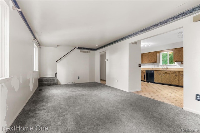 7469 Longworth Dr, Brighton, MI 48116 - unfurnished living room featuring light colored carpet and stairway