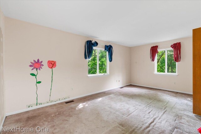 7469 Longworth Dr, Brighton, MI 48116 - carpeted empty room featuring baseboards
