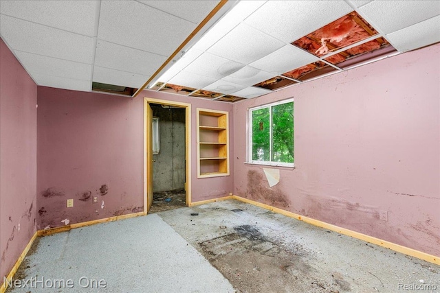 7469 Longworth Dr, Brighton, MI 48116 - empty room with baseboards and built in features