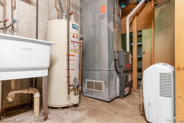 7469 Longworth Dr, Brighton, MI 48116 - utility room featuring gas water heater and heating unit