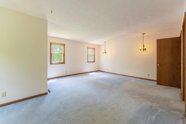 10109 Lauer Rd, Baroda, MI 49101 - carpeted empty room featuring a chandelier and baseboards