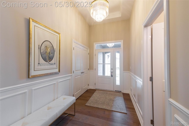 21377 Stone Meadow Dr, Northville, MI 48167 - entrance foyer with a decorative wall, a chandelier, dark wood-style floors, and wainscoting