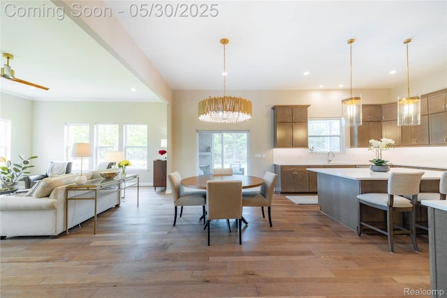 21377 Stone Meadow Dr, Northville, MI 48167 - dining space featuring wood finished floors, recessed lighting, and a chandelier