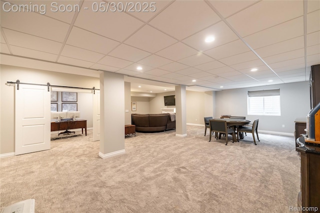 21377 Stone Meadow Dr, Northville, MI 48167 - basement with carpet floors, a barn door, baseboards, recessed lighting, and a drop ceiling