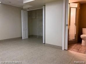 4139 Yorba Linda Blvd, Royal Oak, MI 48073 - unfurnished bedroom featuring baseboards and a drop ceiling