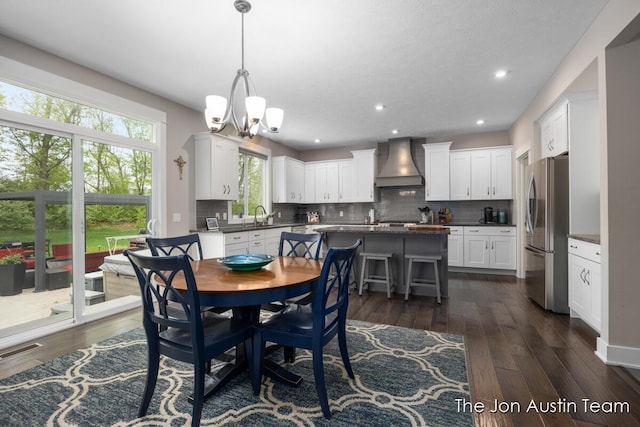 9012 N Wolven Ridge Ct, Rockford, MI 49341 - dining room with a chandelier, dark wood-type flooring, and recessed lighting