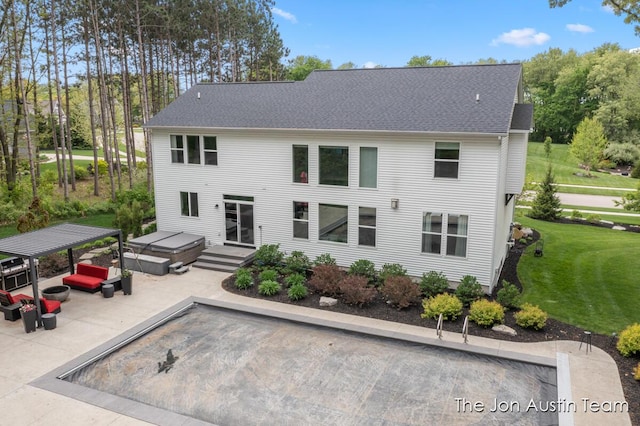 9012 N Wolven Ridge Ct, Rockford, MI 49341 - back of house featuring a patio area, a yard, and roof with shingles