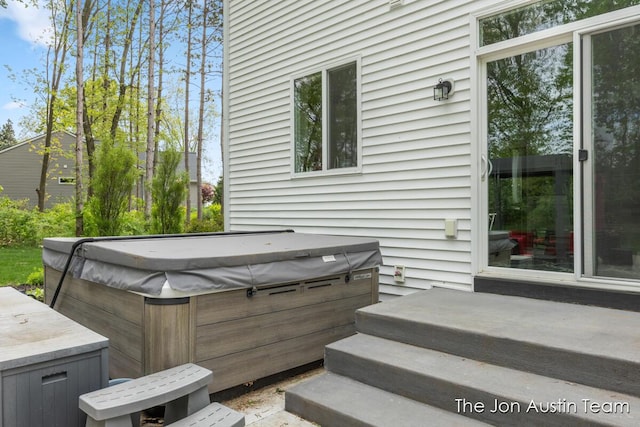9012 N Wolven Ridge Ct, Rockford, MI 49341 - view of patio / terrace with a hot tub