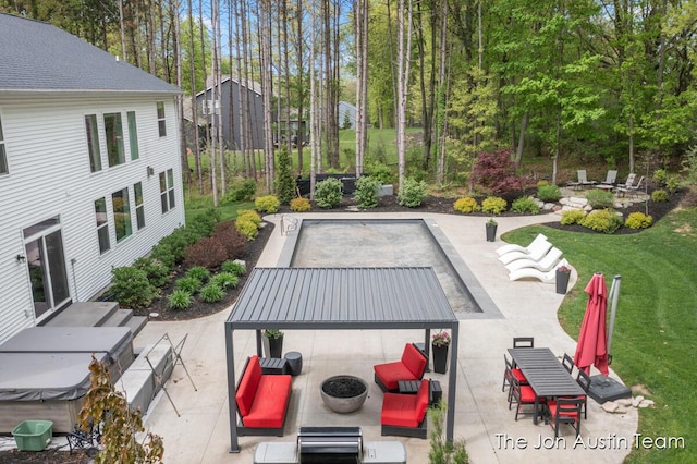 9012 N Wolven Ridge Ct, Rockford, MI 49341 - view of patio featuring a hot tub and a fire pit