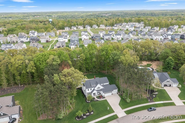 9012 N Wolven Ridge Ct, Rockford, MI 49341 - aerial view of property's location with nearby suburban area and a forest