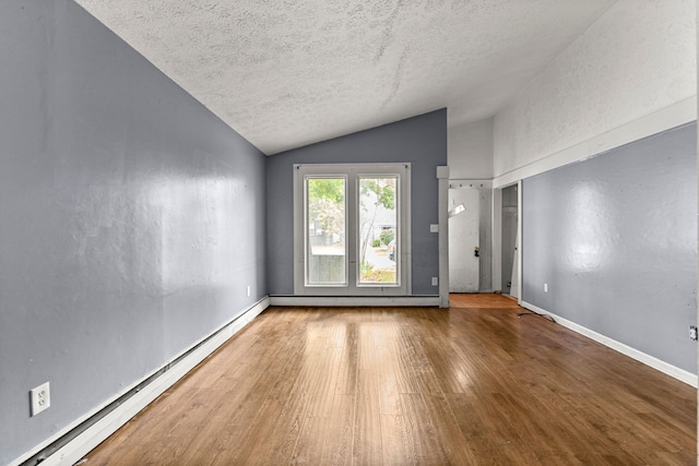 80 E Mahan Ave, Hazel Park, MI 48030 - spare room featuring vaulted ceiling, a baseboard heating unit, a textured ceiling, wood finished floors, and baseboards