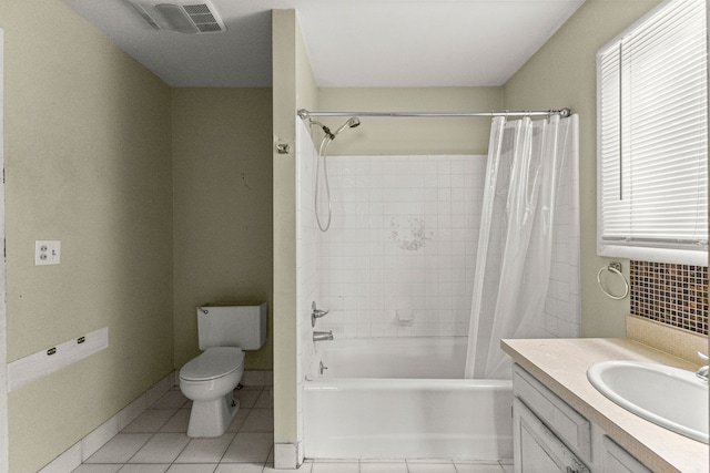 80 E Mahan Ave, Hazel Park, MI 48030 - bathroom with toilet, vanity, tile patterned floors, shower / bath combo with shower curtain, and decorative backsplash
