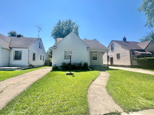 20244 Mccormick St, Detroit, MI 48224 - view of front facade with a front lawn