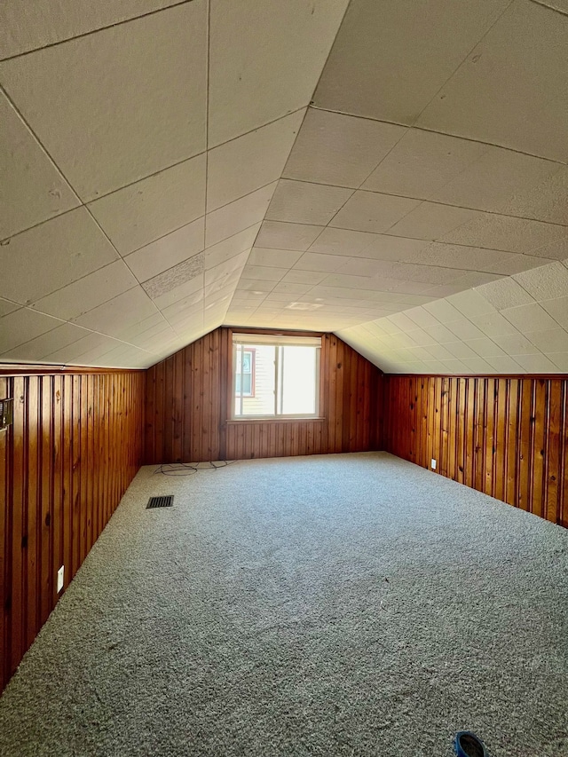 20244 Mccormick St, Detroit, MI 48224 - additional living space featuring lofted ceiling, wooden walls, and carpet floors