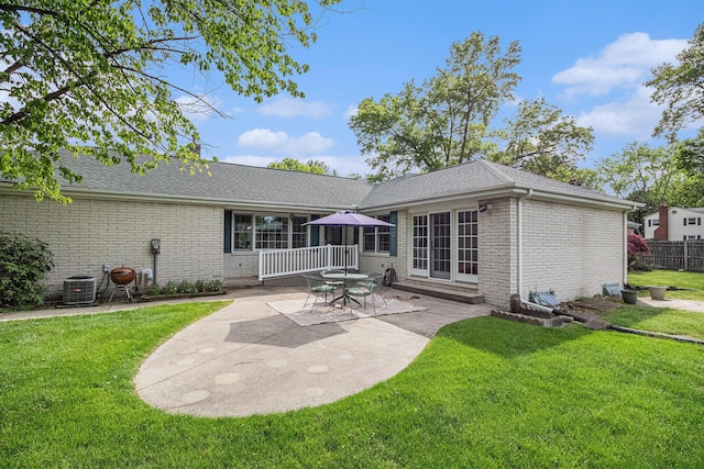 925 Plym Rd, Niles, MI 49120 - back of property with brick siding, a patio, cooling unit, entry steps, and a shingled roof