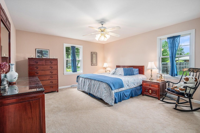 925 Plym Rd, Niles, MI 49120 - bedroom featuring light carpet, multiple windows, baseboards, and a ceiling fan