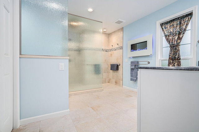 925 Plym Rd, Niles, MI 49120 - bathroom with walk in shower, recessed lighting, tile patterned flooring, and baseboards