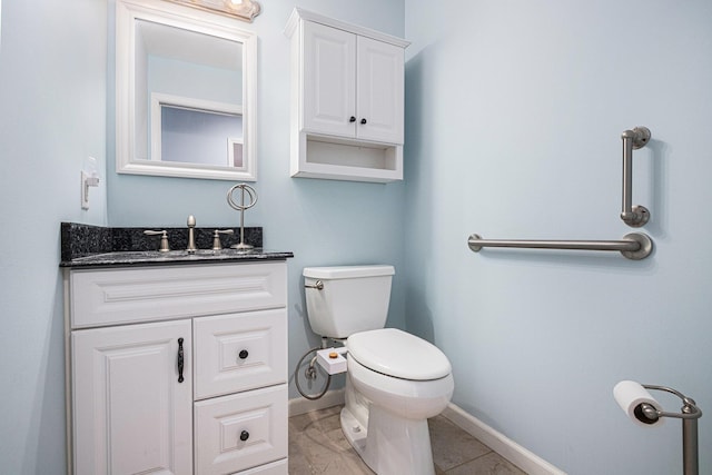 925 Plym Rd, Niles, MI 49120 - half bath with baseboards, vanity, and toilet