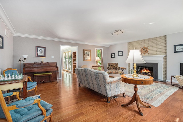 925 Plym Rd, Niles, MI 49120 - living area with wood finished floors, a fireplace, and crown molding