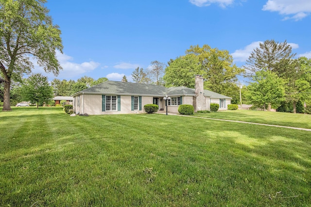 925 Plym Rd, Niles, MI 49120 - ranch-style home with a chimney and a front lawn