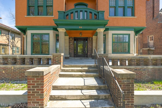 94 E Boston Blvd, Detroit, MI 48202 - view of exterior entry with covered porch and stucco siding