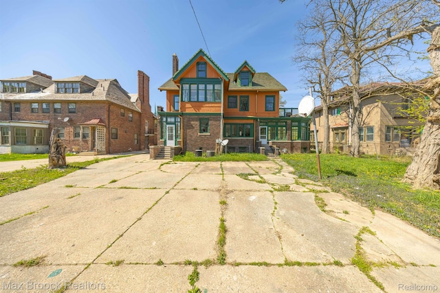 94 E Boston Blvd, Detroit, MI 48202 - back of property with a chimney and brick siding