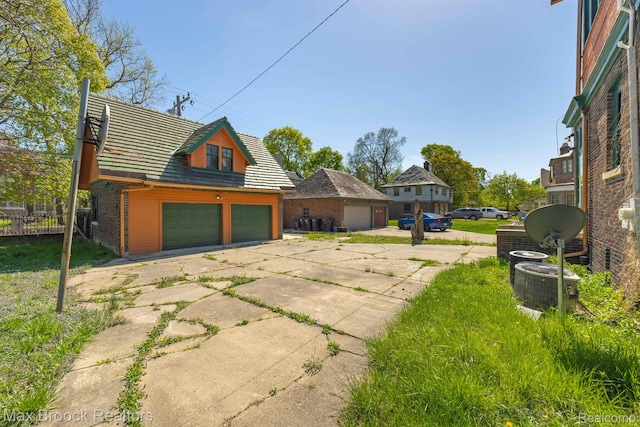 94 E Boston Blvd, Detroit, MI 48202 - view of side of property with brick siding and a tiled roof