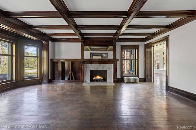94 E Boston Blvd, Detroit, MI 48202 - unfurnished living room featuring radiator, coffered ceiling, beam ceiling, a high end fireplace, and hardwood / wood-style flooring
