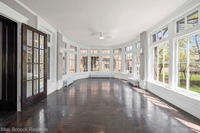 94 E Boston Blvd, Detroit, MI 48202 - unfurnished sunroom featuring radiator heating unit and wood finished floors