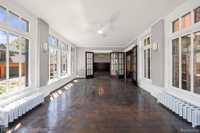 94 E Boston Blvd, Detroit, MI 48202 - unfurnished sunroom featuring radiator, plenty of natural light, and ornamental molding