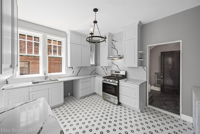 94 E Boston Blvd, Detroit, MI 48202 - kitchen with stainless steel gas range, a chandelier, white cabinets, pendant lighting, and under cabinet range hood