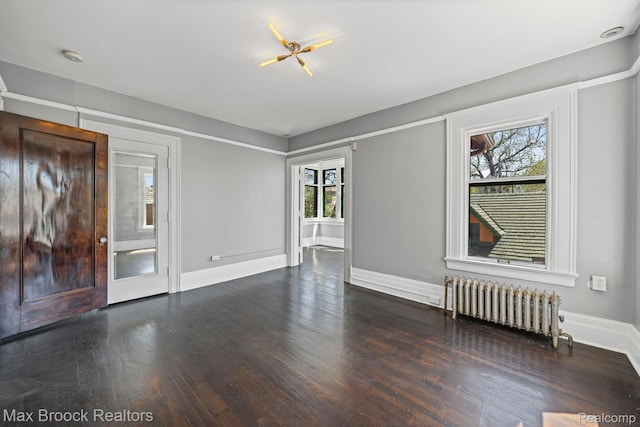 94 E Boston Blvd, Detroit, MI 48202 - unfurnished living room featuring radiator heating unit and wood finished floors