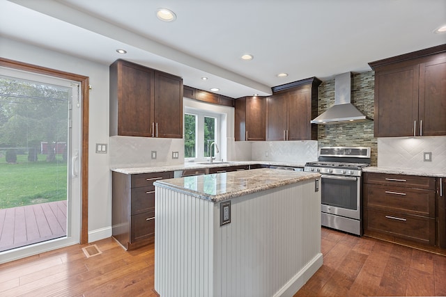1533 Walton Blvd, Rochester Hills, MI 48309 - kitchen featuring stainless steel gas range, wall chimney exhaust hood, a sink, dark brown cabinetry, and recessed lighting