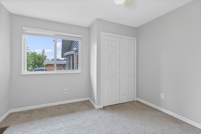 1533 Walton Blvd, Rochester Hills, MI 48309 - unfurnished bedroom featuring carpet floors, a closet, and baseboards