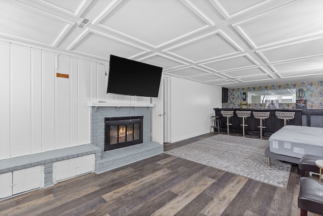 1533 Walton Blvd, Rochester Hills, MI 48309 - living room with a bar, wood finished floors, a brick fireplace, coffered ceiling, and baseboards