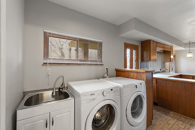 6351 Alden Dr, West Bloomfield, MI 48324 - laundry room featuring separate washer and dryer, cabinet space, and brick patterned floors