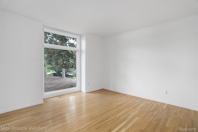 5844 Independence Ln, West Bloomfield, MI 48322 - spare room featuring light wood-style floors and baseboards